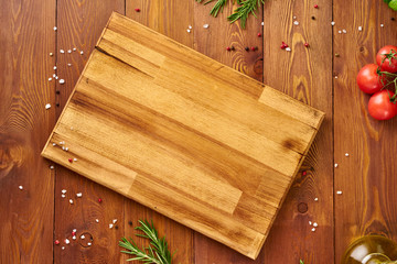 Menu, recipe, mock up, banner. Food seasoning background. Spices, Herbs and wooden cutting board on...