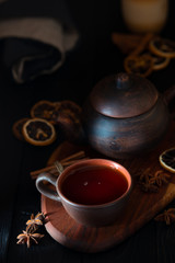 Obraz na płótnie Canvas rustic still life with black tea in a clay cup