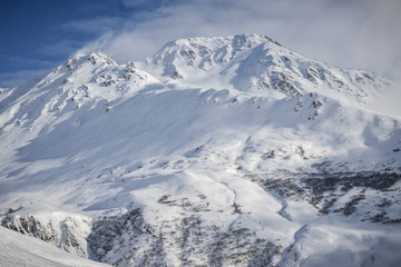 Fototapeta na wymiar Snow covered 2928 meter high Piz Badus near city of Andermatt in central Switzerland