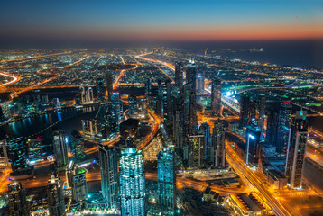 Aerial view of Dubai at night seen from Burj Khalifa tower, United Arab Emirates