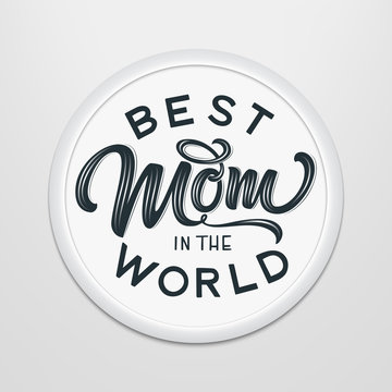 Hand drawn lettering Best Mom In The World in a round frame on the wall. Elegant modern handwritten calligraphy. Mom day. For cards, invitations, prints etc.
