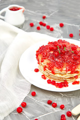 American pancake with jam - berry, viburnum, cranberry