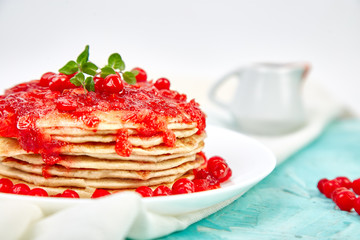 American pancake with jam - berry, viburnum, cranberry
