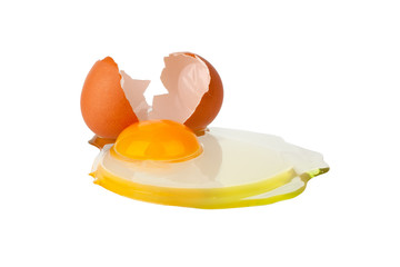 Broken brown egg on white background isolated close up, cracked eggshell and  liquid egg with yellow yolk, two halves of egg shell macro