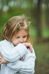 Portrait of sad unhappy little girl. Little sad child is lonesome. upset and distraught angry facial expression.