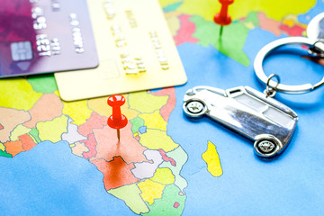 Traveling concept with car and credit card on map