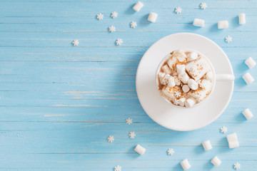 hot chocolate with marshmallow on wooden background