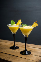 Freeze pineapple cocktail in martini glass. Selective focus. Shallow depth of field.