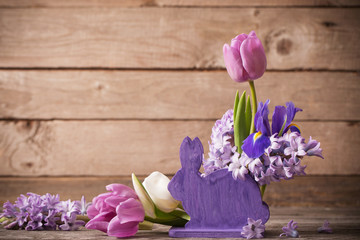 Easter composition on old wooden background