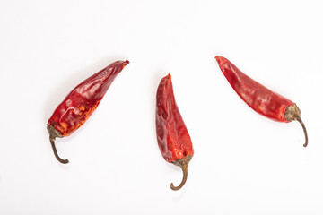 dry red peppers on a white background