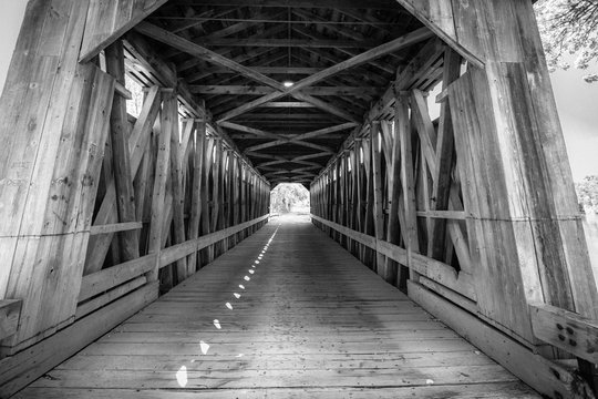 One Lane Bridge. Interior of the Fallasburg covered bridge in Michigan. The historic one lane wooden bridge remains open to auto traffic. 