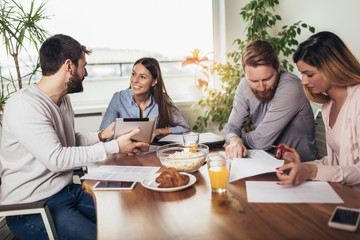 Successful start-up team in training. Business team working on marketing strategy.  Brainstorming meeting concept.