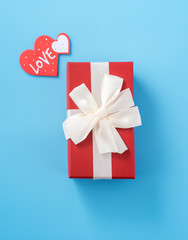 Concept of beautiful Valentine's day, anniversary, mother's day and birthday present and greetings on blue background, copyspace, topview, mockup