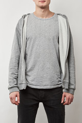 cropped view of man in grey hoodie with copy space isolated on white