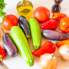 Vegetables and spices for vegetarian stew on wooden table
