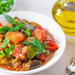 Homemade stewed vegetables on a plate - traditional french rustic dish, ratatouille