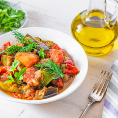 Homemade stewed vegetables on a plate - traditional french rustic dish, ratatouille