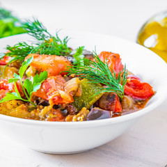 Homemade stewed vegetables on a plate - traditional french rustic dish, ratatouille