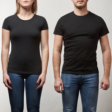 cropped view of young man and woman in black t-shirts with copy space isolated on grey