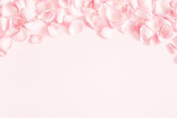 Fototapeta na wymiar Flowers composition. Rose flower petals on pastel pink background. Valentines day, mothers day, womens day, wedding concept. Flat lay, top view, copy space