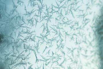 abstraction snowflakes on glass in the winter