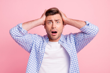 Close up photo of pretty attractive oh no epic fail he him his man hands in hair on head mouth opened eyes full of fear wearing casual shirt outfit isolated on pale rose background
