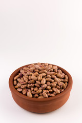 A plate of beans on white background