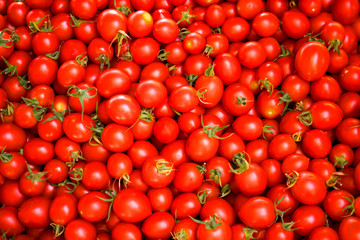 Fresh red tomatoes at a farmers market. Healthy food, organic vegan background