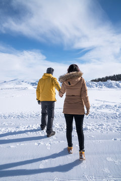 People, Season Concept - Happy Couple Walking Outdoors In Winter.