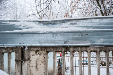 old soviet concrete fence with metal profile