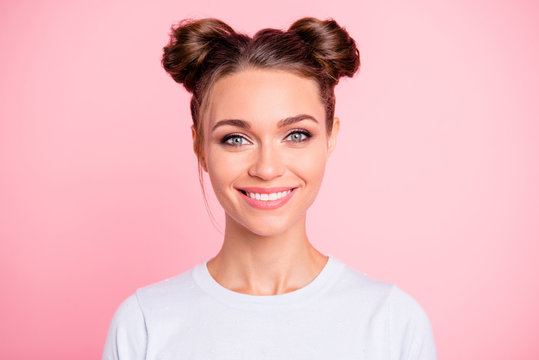 Close-up portrait of her she nice attractive lovable cute adorable winsome cheerful cheery girl with buns isolated over pink pastel background