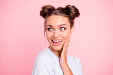 Close-up portrait of her she nice cute lovely attractive winsome adorable cheerful cheery girl with buns touching cheek isolated over pink pastel background