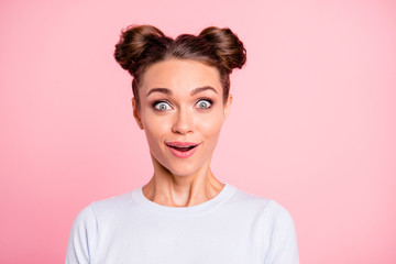 Close-up portrait of her she nice-looking lovely adorable attractive funny cheerful cheery girl with buns isolated over pink pastel background