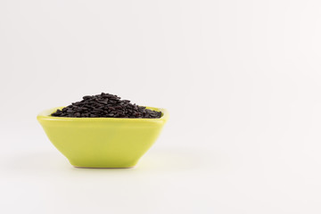 bowl of black wild rice isolated on white background