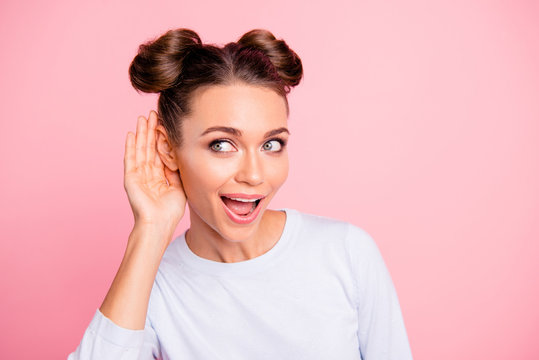 Close-up portrait of nice adorable lovable attractive lovely sweet cheerful funny girl listening to news message isolated over pink pastel background