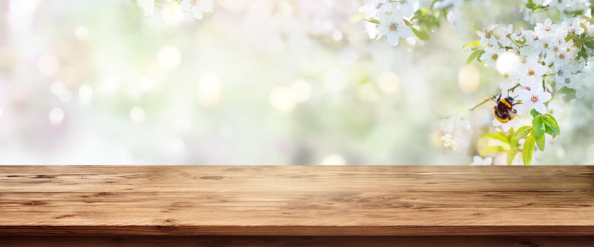 Spring scenery with wooden table