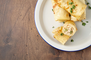 Savory crepe rolls with ground meat filling. Traditional Russian Shrovetide festival meal
