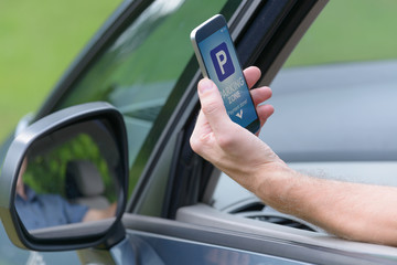 Driver using smartphone app to pay for parking