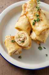 Savory crepe rolls with ground meat filling. Traditional Russian Shrovetide festival meal