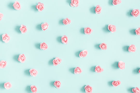 Fototapeta Flowers composition. Pink rose flowers on pastel blue background. Valentines day, mothers day, womens day concept. Flat lay, top view