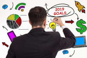 Business, technology, internet and networking concept. Young entrepreneur showing keyword: 2019...