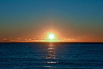Fototapeta premium Backlight sea sunrise over the Mediterranean Sea, Alassio, Liguria, Italy