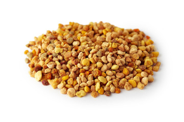 Pile of bee pollen grains isolated on white background
