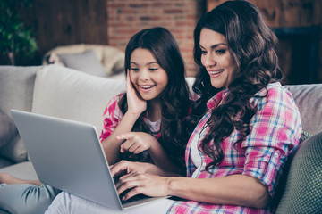 Close-up portrait of nice-looking cute lovely winsome attractive charming cheerful cheery dreamy wavy-haired people watching cartoon in house indoors