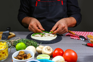 Cook preparing mexican tacos flat lay composition, border Mexican cooking recipe
