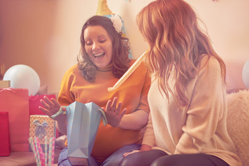 Obraz na płótnie Canvas Pregnant woman celebrating baby shower party with friends.
