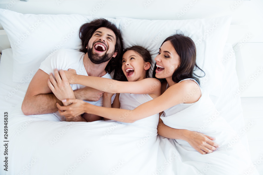 Sticker Top above high angle view of nice cute sweet lovely adorable attractive cheerful cheery glad people lying in bed enjoying cuddling daddy in modern white light interior room indoors