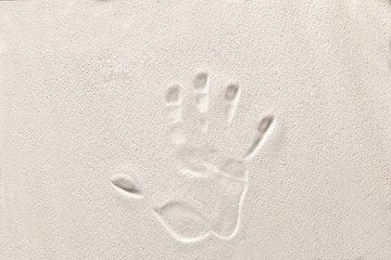 hand prints on the sand with copy space for your text