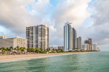 Fototapeta premium empty beach at Sunny isles beach, Miami in early morning with skyscraper