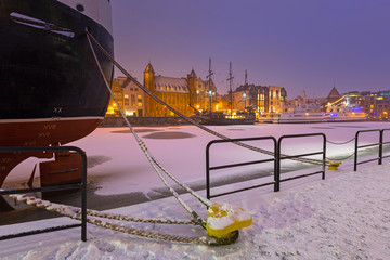 Old town of Gdansk over Motlawa river at snowy winter, Poland